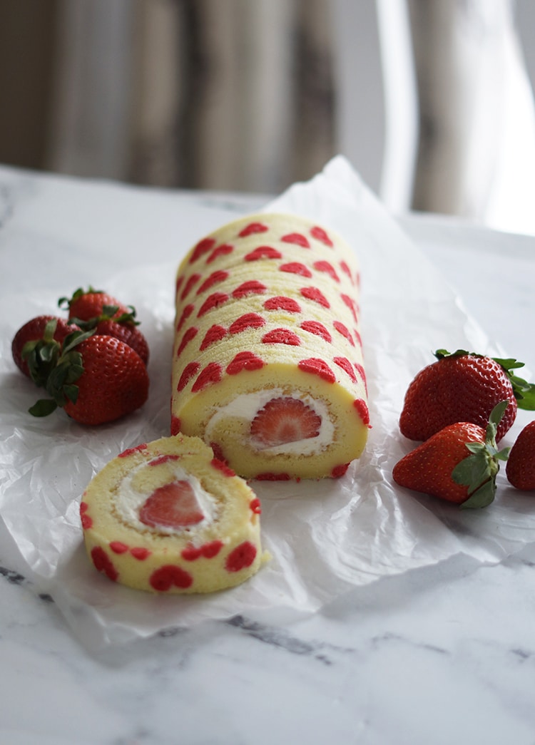 Valentine Strawberry Swiss Roll with Cream Cheese Frosting- These recipe has been tested for your success. Chiffon cake filled with cream cheese frosting and fresh strawberry.Gift this to your love ones this Valentines day.