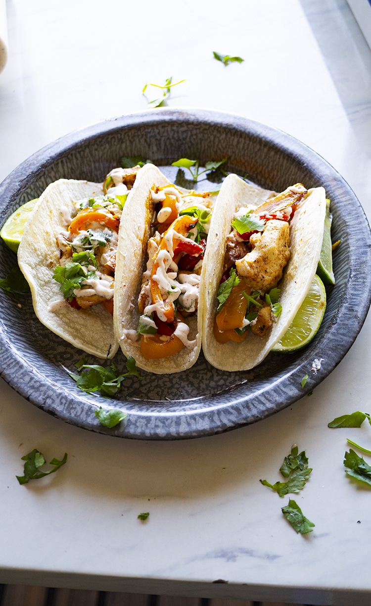 SHEET PAN CHICKEN FAJITA WITH SOUR CREAM LIME SAUCE. Bake in a single sheet pan, this Chicken Fajita is to die for. With simple prep, easy clean up and a Chicken Fajita ready in less than 30  minutes, I think it is about time to dive into sheet pan cooking.