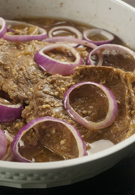 Bistek Tagalog is a Filipino version of beef steak. It has citrus flavor and a mixture of salty and sweet taste. It's a cheap version of beef steak.