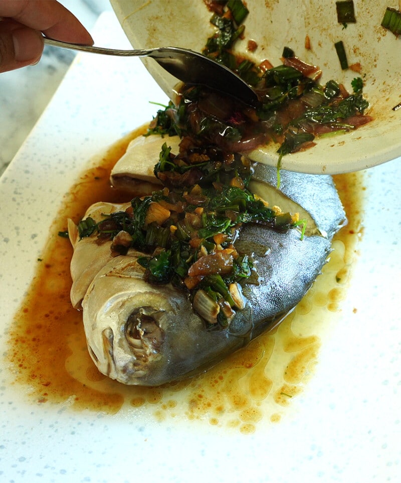 Immediately pour the sauce on top of the steamed fish. 